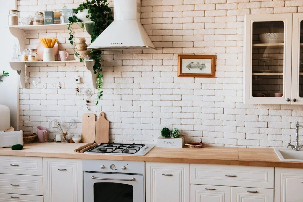 Photo by Dmitry Zvolskiy from Pexels: https://www.pexels.com/photo/chopping-boards-near-oven-under-hood-2062426/