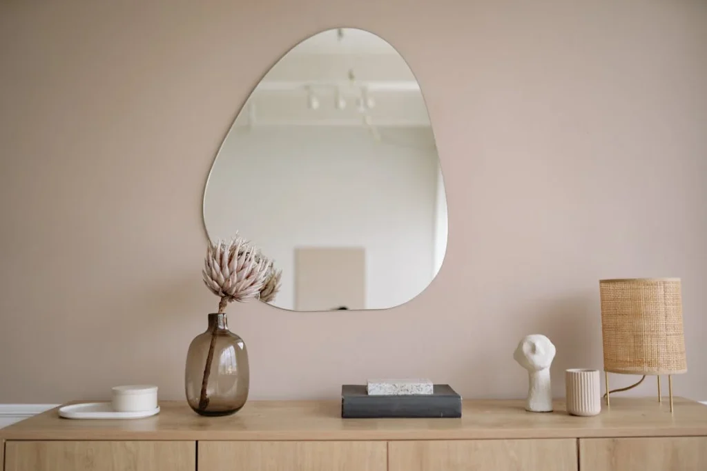 Photo by Yan Krukau from Pexels: https://www.pexels.com/photo/a-mirror-wall-above-a-cabinet-5793642/